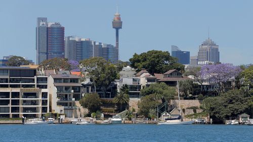 Sydney office buildings and commercial real estate appear behind Sydney waterfront properties