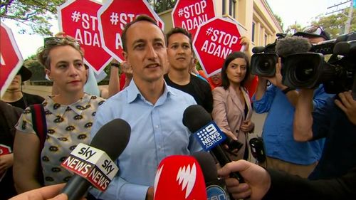 Mr Sharma was confronted by climate change protesters.