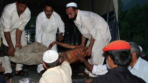 Pakistani's shift the dead body of a Shiite Muslim at a hospital in Ghari Hbibullah in the northwestern district of Mansehra. (Getty)