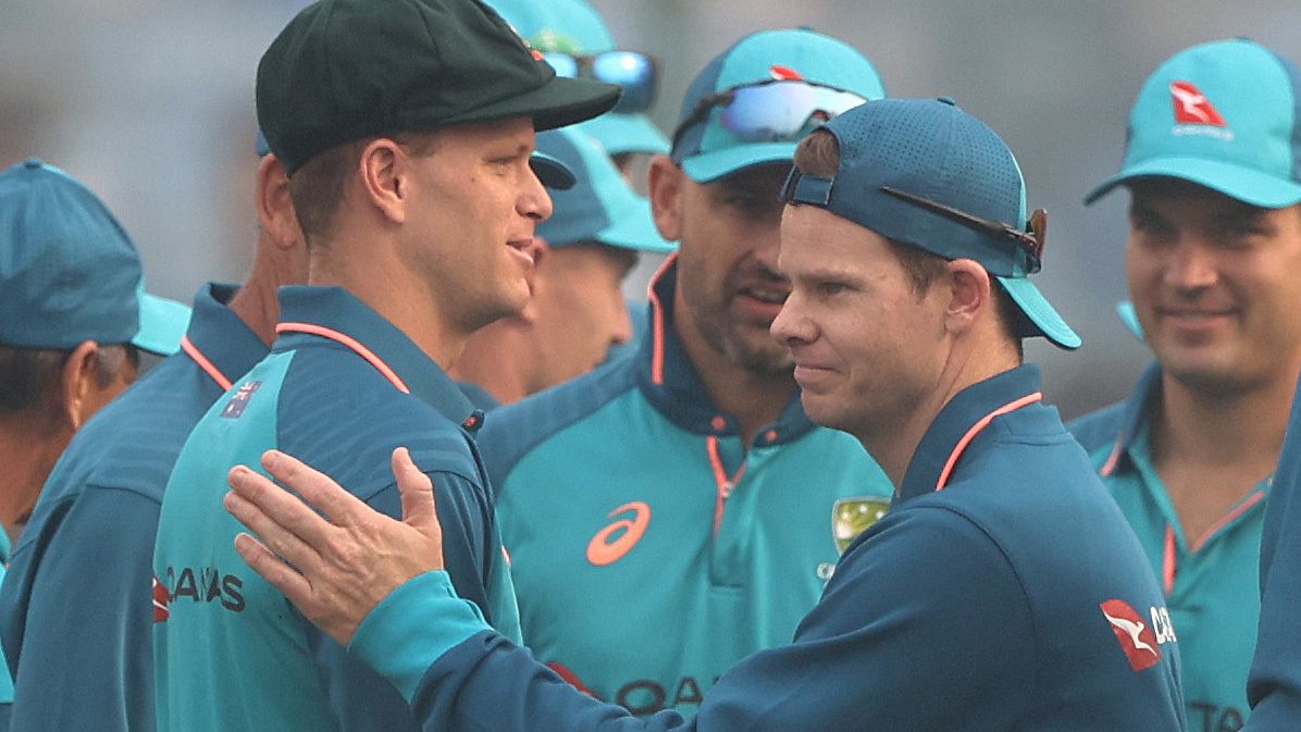 Matthew Kuhnemann is congratulated by Steve Smith after he was capped to play his first test match for Australia.