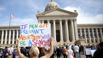 A person holds a sign during the Bans Off Oklahoma Rally on the steps on Oklahoma state Capitol to protest against the state&#x27;s abortion bill.