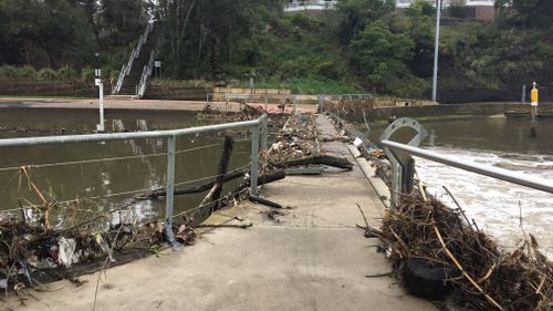 The downpour caused debris to be strewn across pathways in the area.