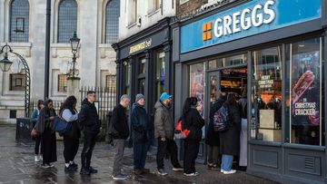 People queue outside Greggs in December 2023 in London.