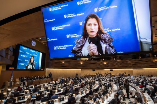 Ukraine's deputy Foreign Minister Emine Aiiarovna Dzhaparova is seen on a TV monitor speech, during the 49th session of the UN Human Rights Council about the Urgent Debate on the "situation of human rights in Ukraine stemming from the Russian aggression" at the European headquarters of the United Nations in Geneva, Switzerland, Thursday, March 3, 2022.   