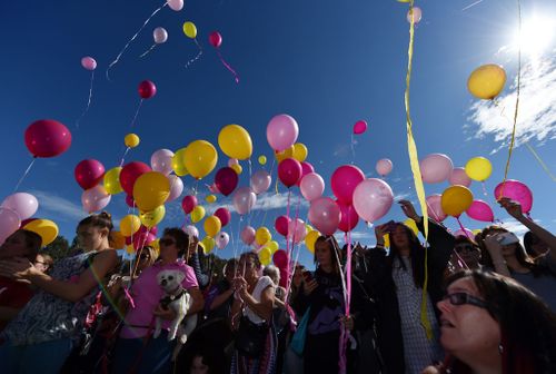 Family and friends set off balloons at a vigil for Sanaya.