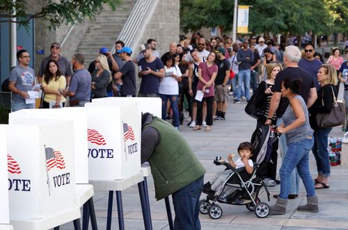 A voter marks his ballot at an early voting polling station at West Los Angeles College in Culver City, California.