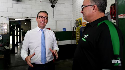 South Australian Liberal leader Steven Marshall speaks to franchisee Rocky Carbone (right) during a visit to Ultra Tune Unley in Adelaide. (AAP)