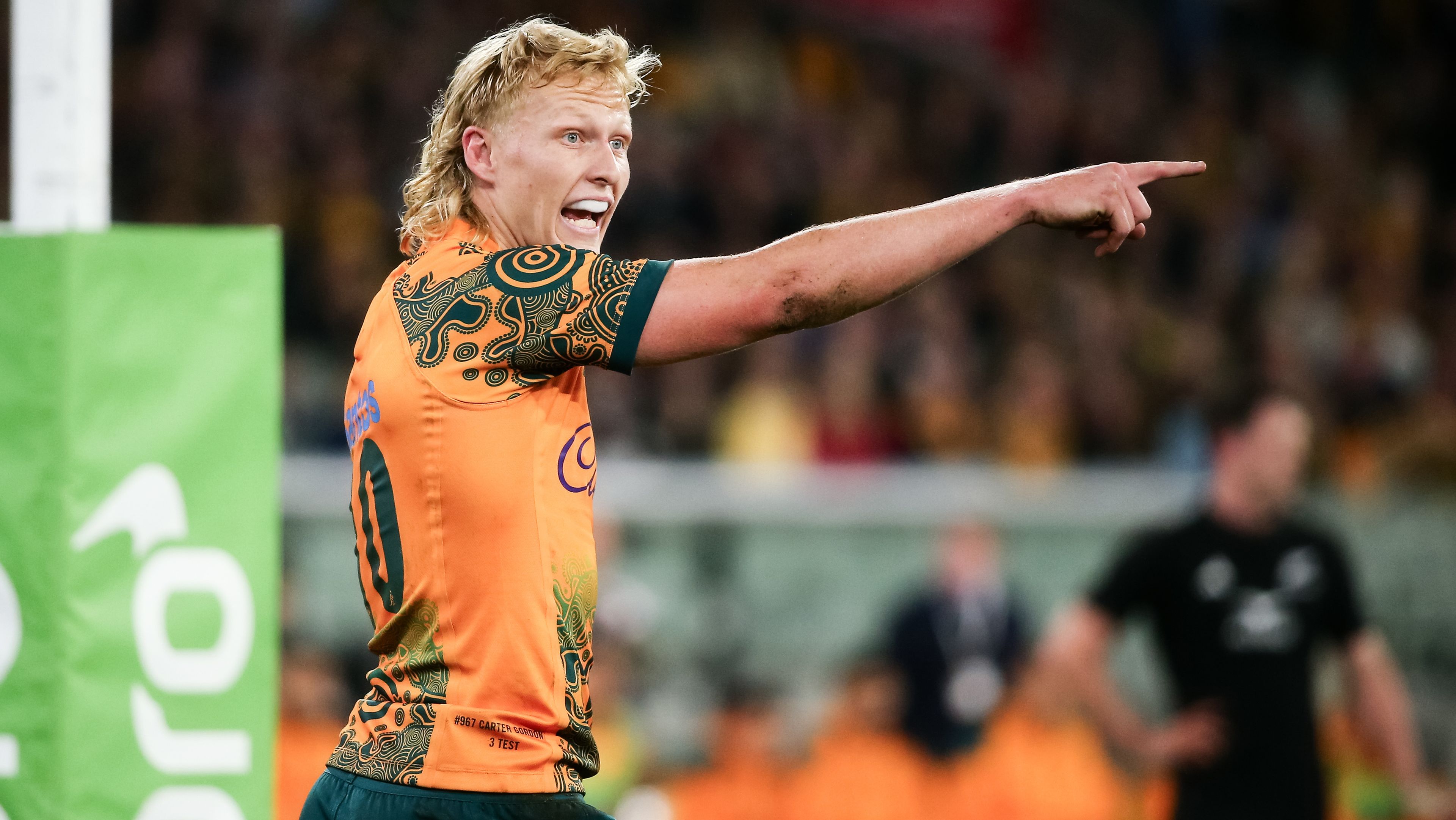 Carter Gordon of the Wallabies gestures to his team.