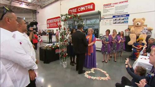 The happy couple exchanged their vows in front of about 90 of their closest family and friends - plus a few confused shoppers. 