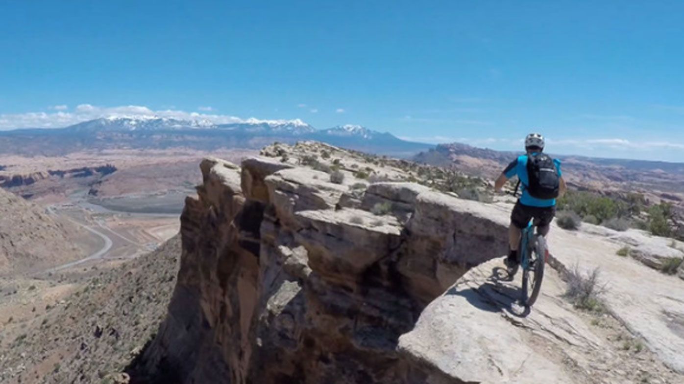 Mountain bikers risk life and limb on death-defying ride 