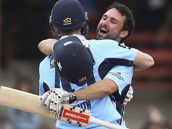 Steve Smith (L) and Ed Cowan celebrate after hitting the winning runs for NSW. (Getty)