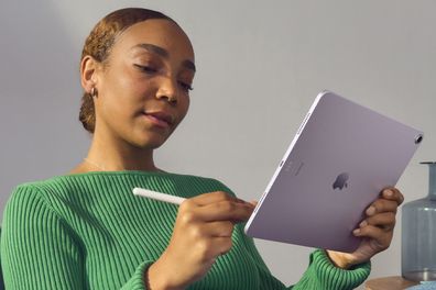 9PR: A woman using an Apple iPad Air with an Apple Pencil Pro