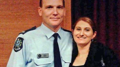 Anndrea Hocking (right) with husband Adrian during his days on the police force.