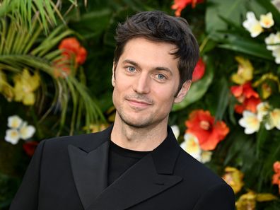 Lucas Bravo attends the World Premiere of "Ticket to Paradise" at Odeon Luxe Leicester Square on September 07, 2022 in London, England. 