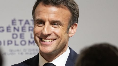 French President Emmanuel Macron smiles after delivering his speech during the National Roundtable on Diplomacy at the foreign ministry in Paris, Thursday, March 16, 2023. France's Foreign Ministry is undertaking a sweeping review of its vast diplomatic corps, an effort driven by President Emmanuel Macron to adapt French diplomacy to 21st century challenges. (AP Photo/Michel Euler, Pool)