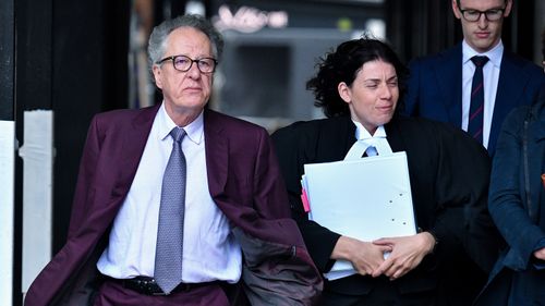 Australian actor Geoffrey Rush (left) arrives at the Federal Court in Sydney, Wednesday, October 24, 2018. Rush is suing Nationwide News for defamation.