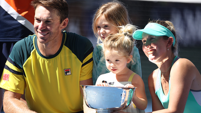 John Peers and Storm Sanders, with his children, celebrate doubles title