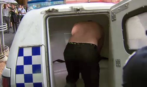 The former kickboxer was taken away in a police cruiser after getting into a physical fight inside a Melbourne court. 