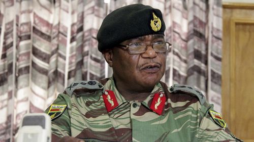 Zimbabwe's Army Commander, Constantino Chiwenga addresses a press conference in Harare. (AAP)