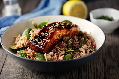 Home made fresh wild rice salad with grilled teriyaki salmon fillet