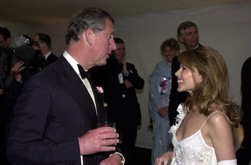 Over the course of her career, Kylie Minogue has met a number of celebrities, including the Prince of Wales at a charity gala dinner in 2001. Picture: PA