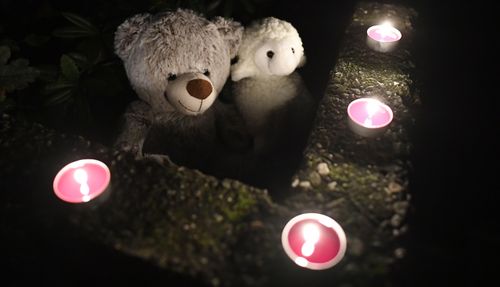 Teddy bears and candles are displayed in front of a house, Thursday, Sept. 3, 2020, in Solingen, Germany. 
