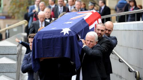 Richards' casket was carried out to the strains of Frank Sinatra's "New York, New York. (AAP)