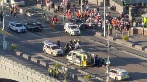 A man has been shot and four have been injured in two separate incidents after a night of "chaos" on Princess Bridge in Melbourne's CBD.