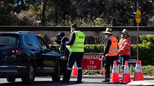 Security staff pictured monitoring visitors at Rookwood Cemetery.