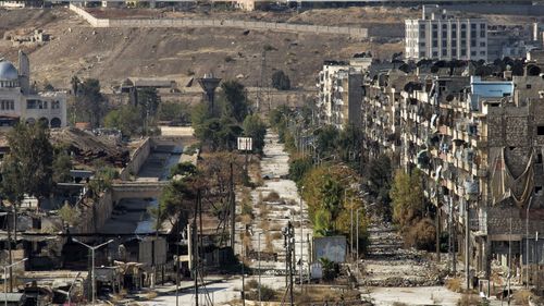 A picture taken on November 4, 2016 from a rebel-held eastern neighbourhood of Aleppo near Souq al-Hal market shows an empty street leading to a crossing point with the government-held neighbourhood of al-Masharka. (AFP)
