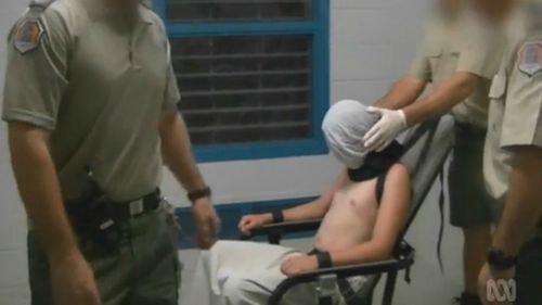 Dylan Voller tied to a chair in the Don Dale detention centre. (AAP)