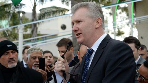 Labor MP Tony Burke speaks to Muslims outside Lakemba Mosque in Sydney. (Getty)