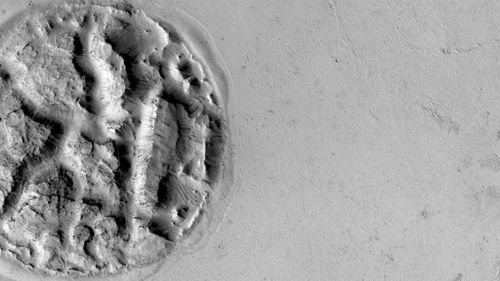 Scientists scratching heads over 'cookie' landform on Mars