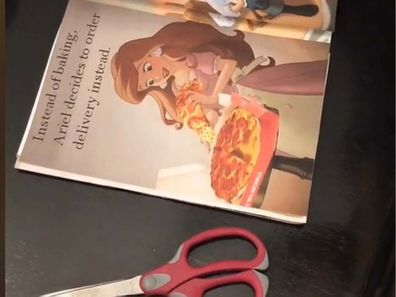 A Disney storybook with edited pages, and scissors placed next to the book