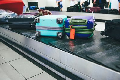 Shot of luggage on a conveyor belt at an airport