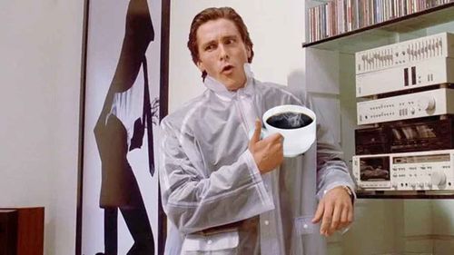 Christian Bale enjoys a cup of black coffee in an undoctored screenshot from American Psycho.