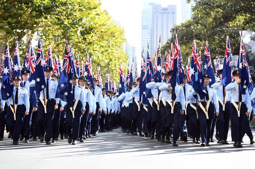 Flag bearers take part in the Anzac Day March in Sydney last year. (AAP)