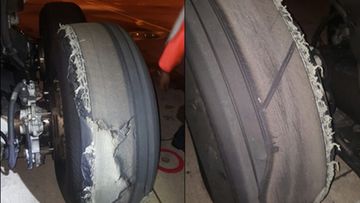 The plane tyre "delaminated" and punctured the wing flap panel. (ATSB)