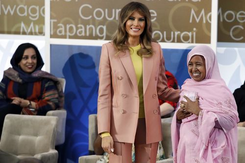 First lady Melania Trump, center, presents an International Women of Courage award to L'Malouma Said of Mauritania. (AAP)