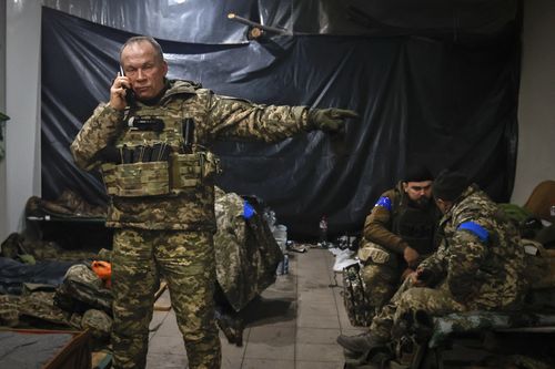 Commander of the Ukrainian army, Col. Gen. Oleksandr Syrskyi, gives instructions in a shelter in Soledar, the site of heavy battles with the Russian forces, in the Donetsk region, Ukraine, Sunday, Jan. 8, 2023.  