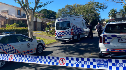 Crime scene established in Stretton Brisbane after two people were found dead.