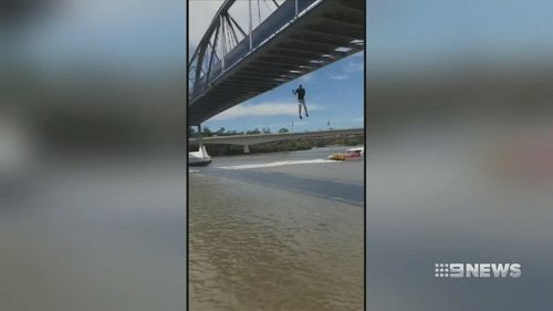 Video shows Mr Erin leaping from Goodwill Bridge into the Brisbane River.  (Luke Erwin 23 / Facebook)