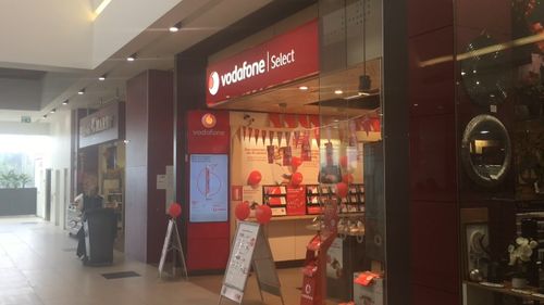 The offenders entered a Vodafone store and stole a mobile phone before sprinting away. Picture: 9NEWS