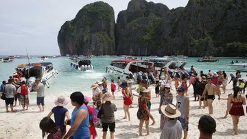 Crowds of visitors at Maya Bay in Thailand.