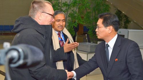 Jeffrey Feltman, left,, UN undersecretary general for political affairs, is greeted by a North Korean Foreign Ministry official at Pyongyang airport. (Photo: AP).