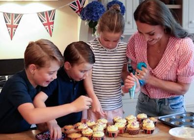 Prince George, Prince Louis and Princess Charlotte help Kate decorate the cupcakes