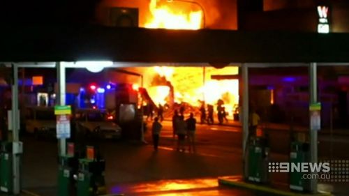 The fierce blaze attracted onlookers. (9NEWS)