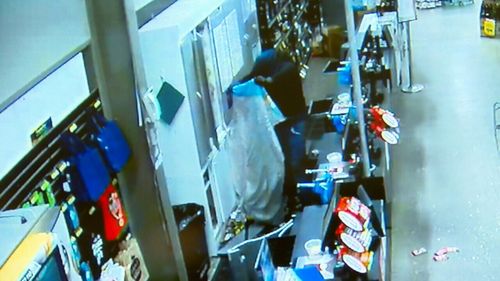 A group of men were caught on CCTV camera forcing their way into at least seven businesses and ransacking each location. Picture: Supplied.