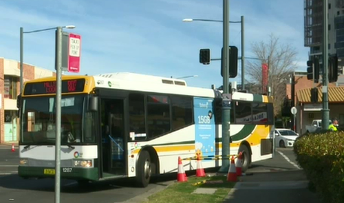 A woman is critical after being hit by a bus.