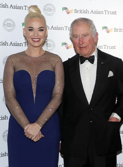 Prince of Wales, Royal Founding Patron, the British Asian Trust, meets musician Katy Perry, left, as he arrives to attend a reception for supporters of the British Asian Trust in London, Tuesday, Feb. 4, 2020.